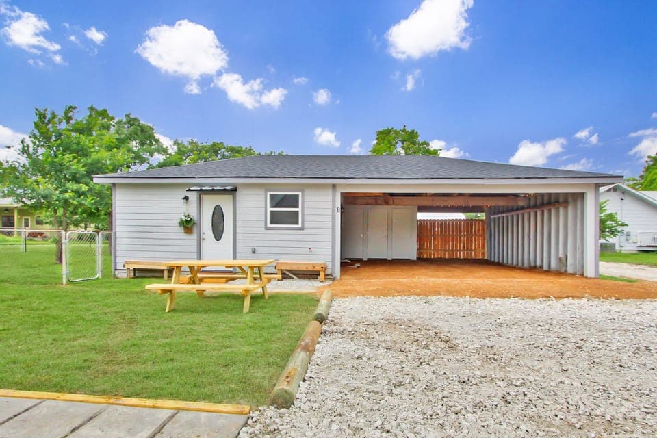 Front of home with covered parking.