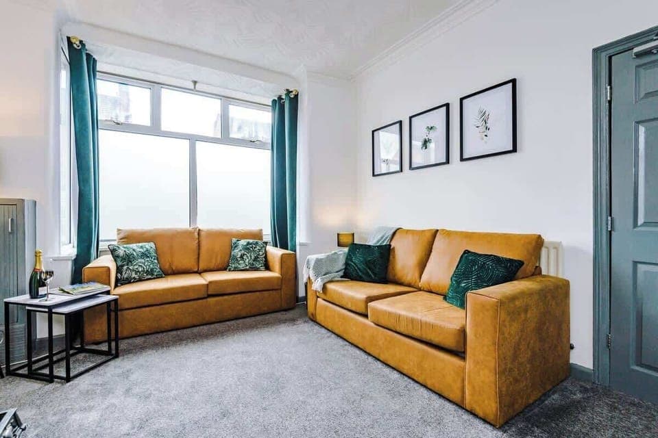 The spacious living room boasting a comfortable double sofa bed, 40-inch Smart TV with Netflix and plenty of space to sit down in the evenings.