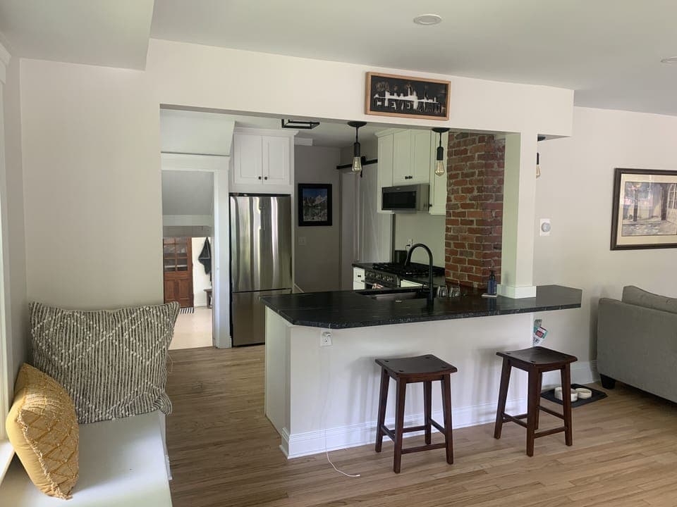 Granite counter tops and table - w stools and benches to have meals together.