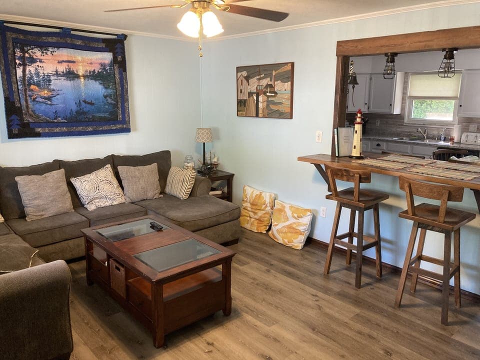 Living room shades (pull up/down), wall tabletop, games in floor table. 