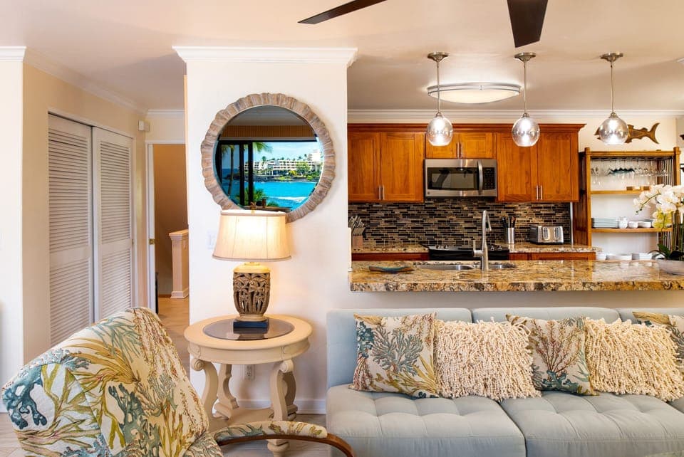 View from living room into kitchen with reflection of Sheridan Hotel in the wall mirror.