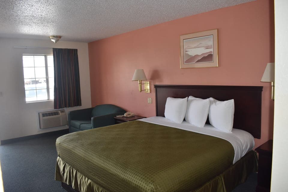 Economy Single Room, Non Smoking | Blackout drapes, iron/ironing board, free WiFi, bed sheets