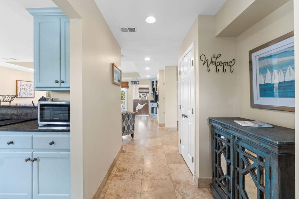 Step into Captain Jax through a bright, inviting entryway featuring coastal decor, natural light, and warm tones that set the stage for your beachside retreat.
Professionall Managed by
Breathe Easy Rentals