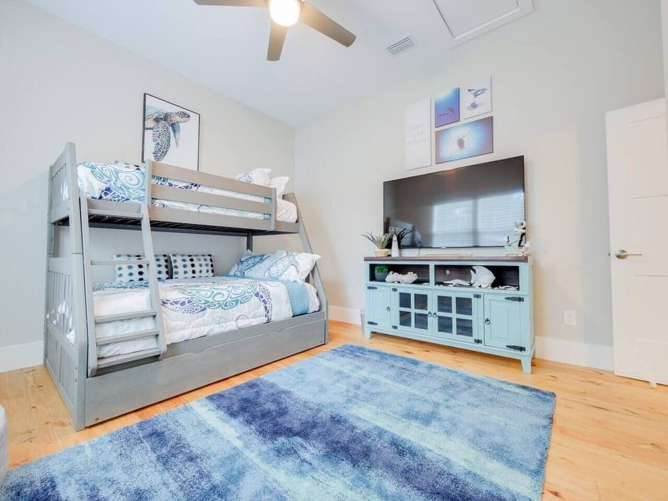 Bedroom three not only offers twin over full bunk and trundle but smart TV and ceiling fan as well. 