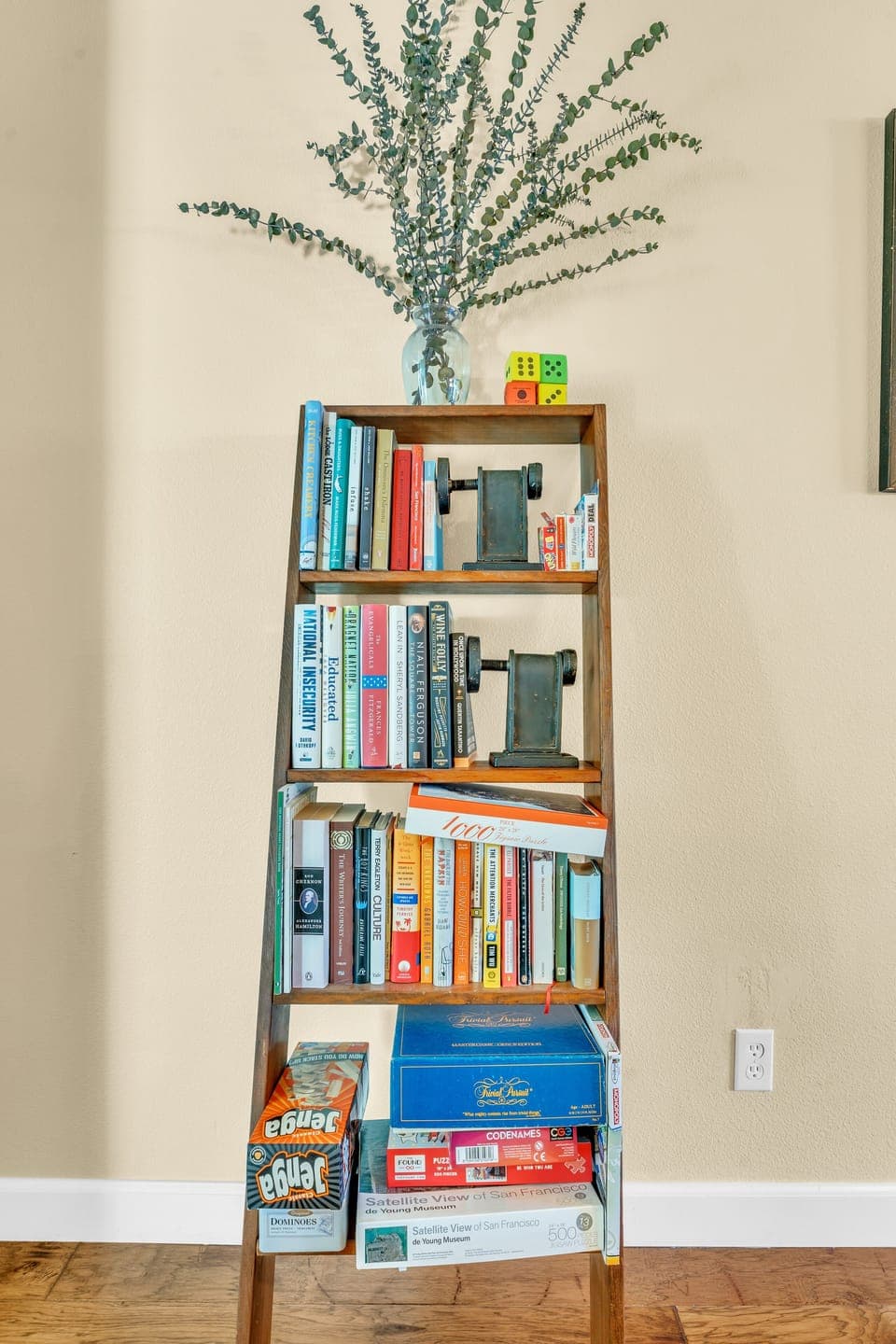 Books and games—Monopoly Deal, Trivia Pursuit, Jenga, Codenames, puzzles, cards