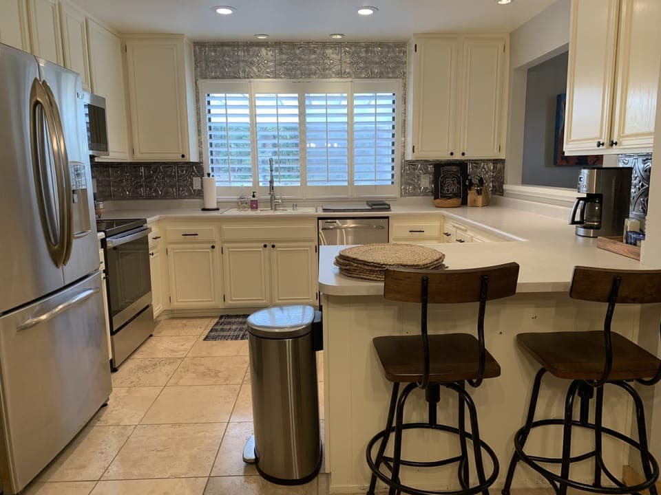 Fully stocked kitchen open to family room