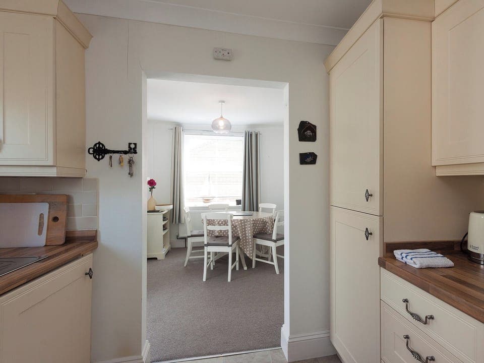 View through to the dining area from the kitchen | Evelyn Cottage, Dartmouth