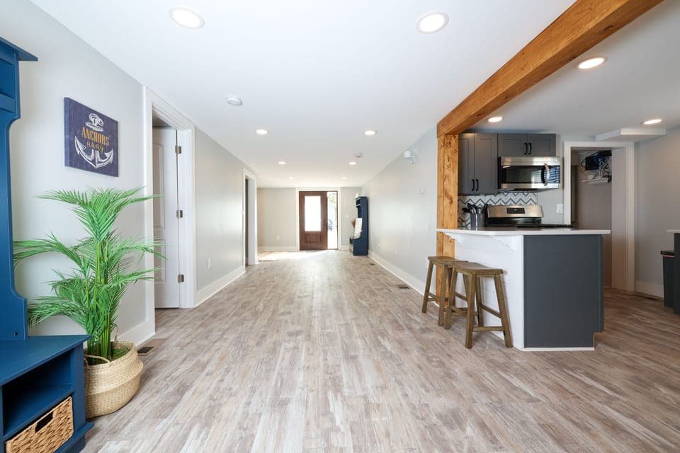 Open and flowing floor plan leads to Indian Lake.