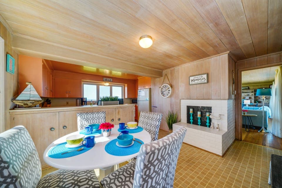 Dining nook next to the kitchen with candle-filled fireplace