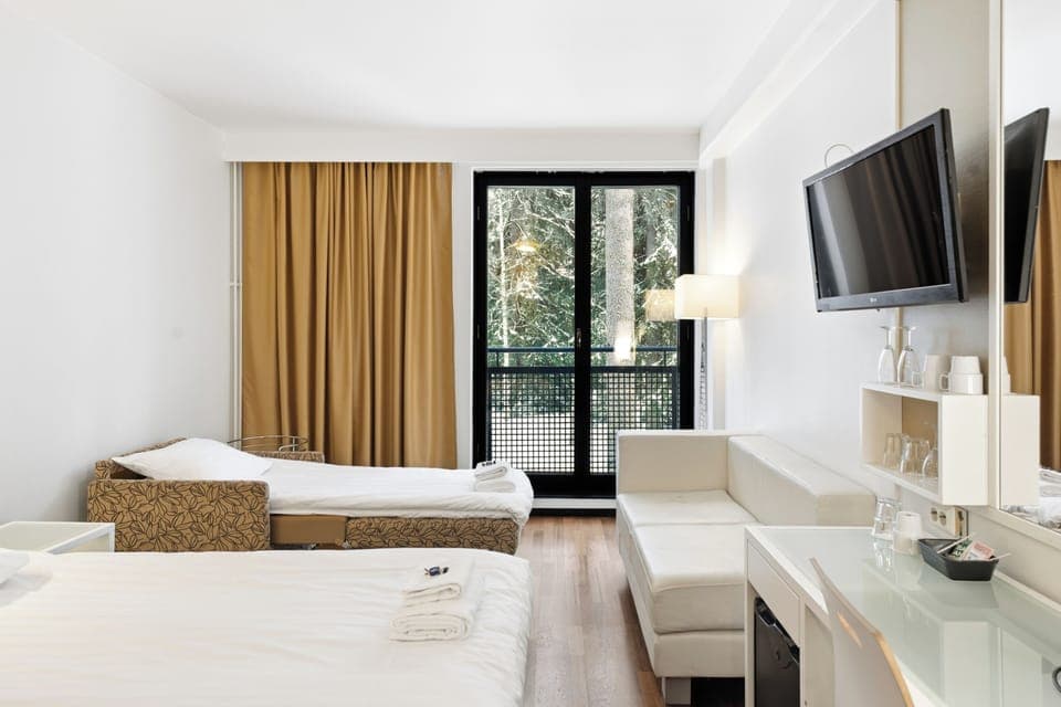 Standard Triple Room (Spa Building) | Desk, laptop workspace, blackout drapes, free WiFi