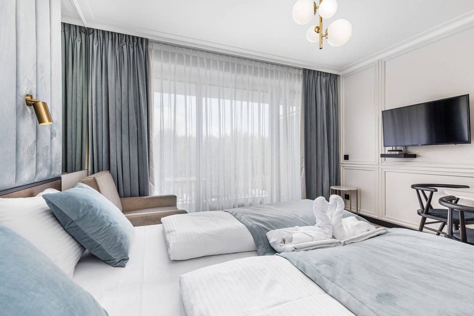 Bright living room with a large window and minimalist decor