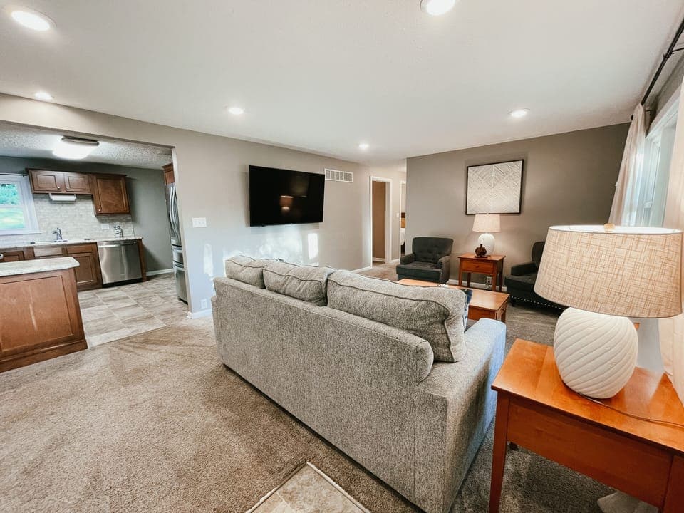 Living room featuring a queen sleeper sofa. 