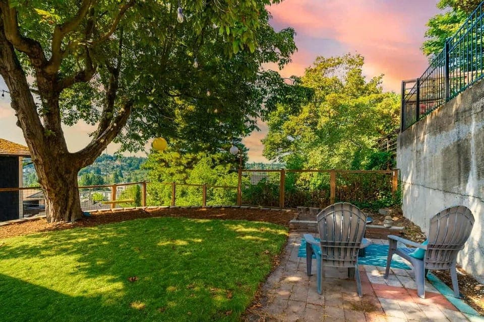 Enjoy fresh air and quiet moments in this charming backyard nook.