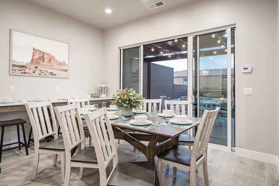 Open concept dining area with dining table for 8 plus 8 stools