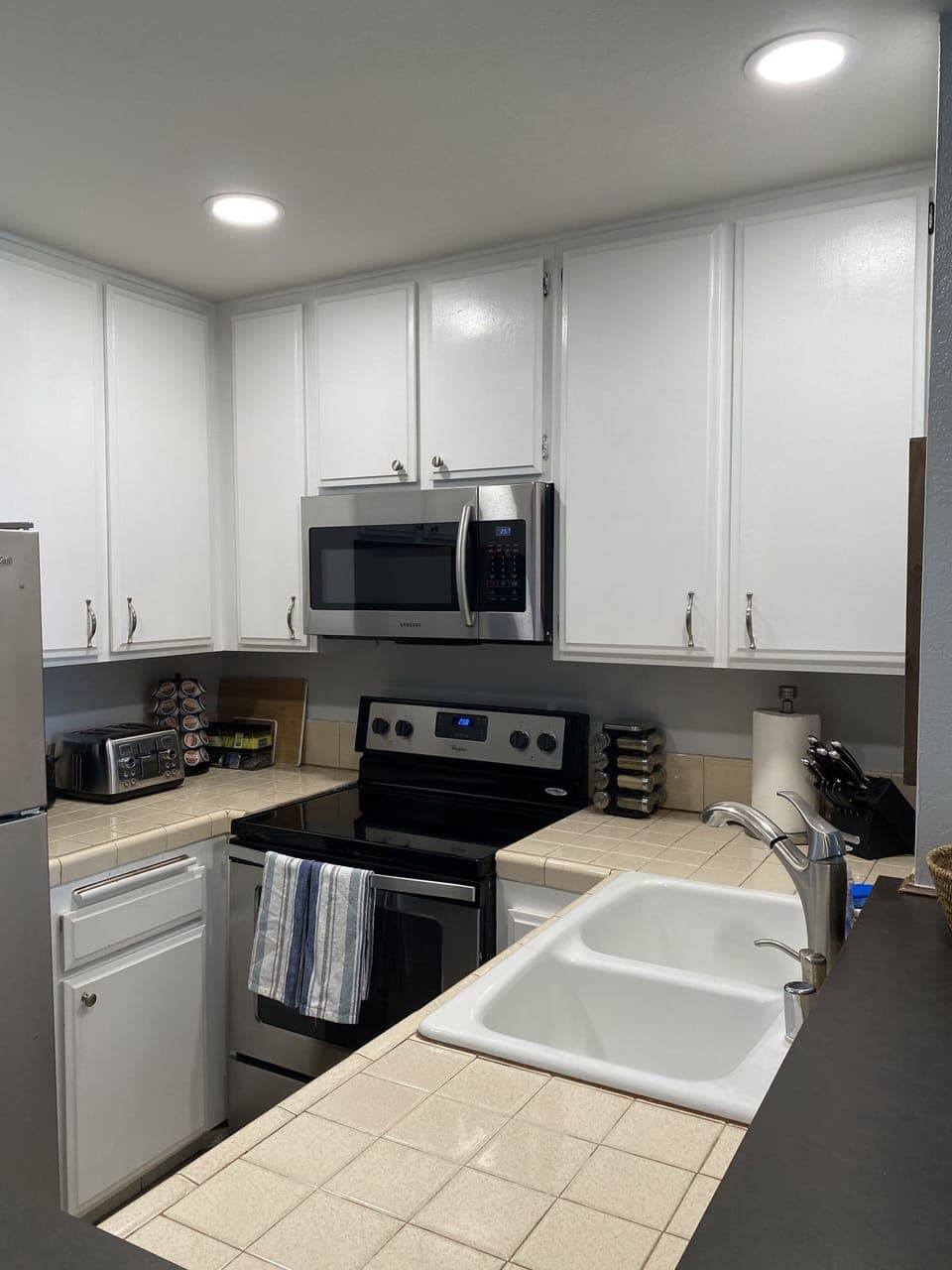 Kitchen with Recessed Lighting and Stocked with Everything you may Need