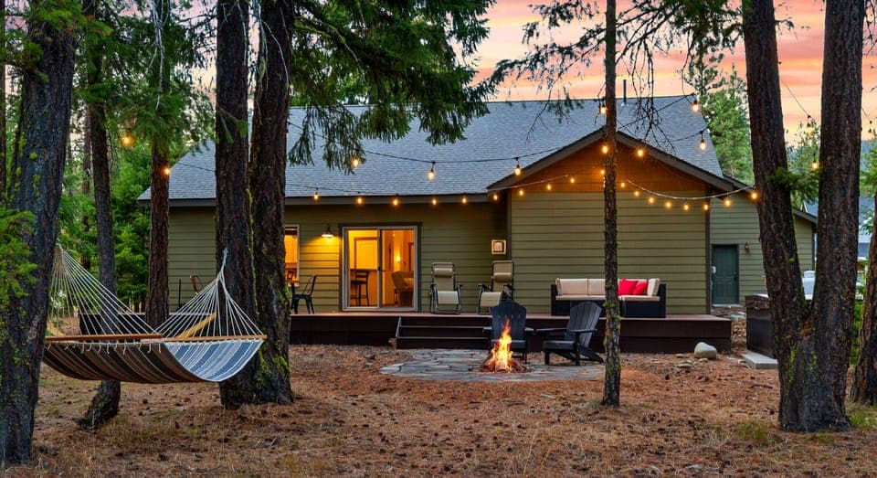 Backyard: Dining table, seating area, hot tub, wood fire pit