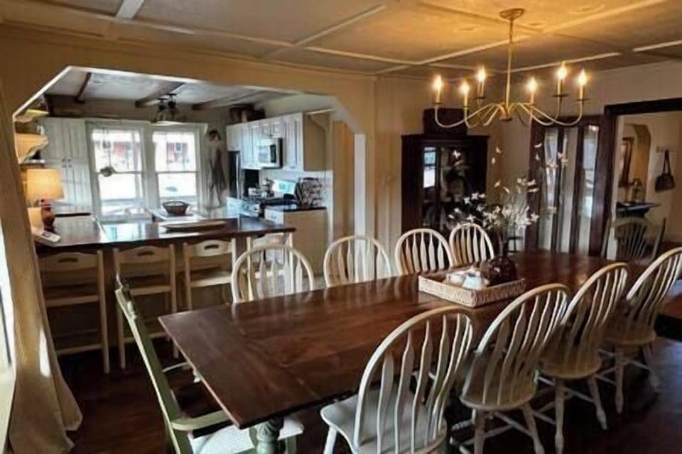 Dining room with view into kitchen; space to both prepare and enjoy a large meal