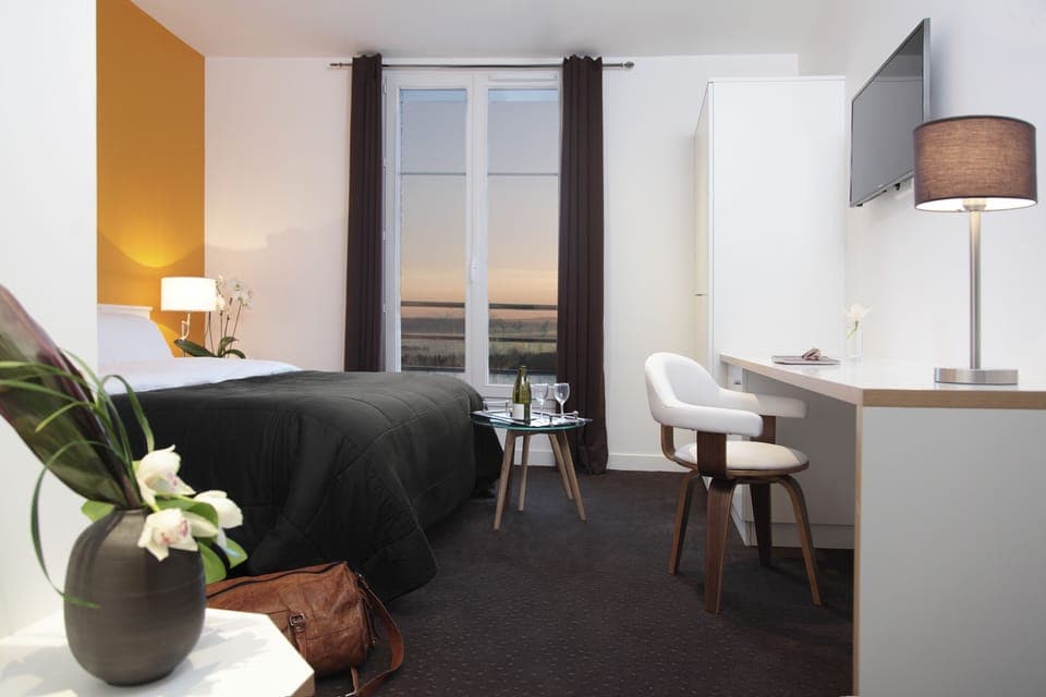 Premium bedding, desk, laptop workspace, soundproofing