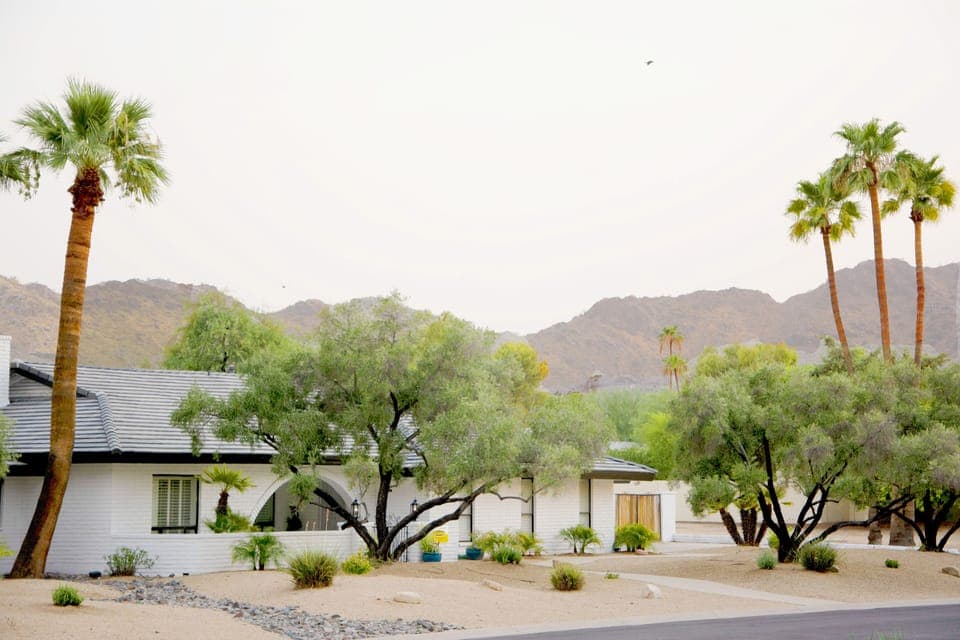 Front of the home with the Mummy Mountains in the background.