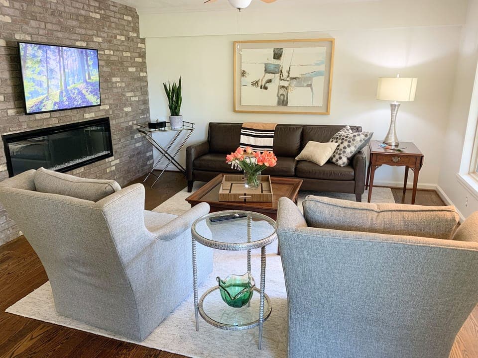 Living room with smart tv and electronic fireplace. 