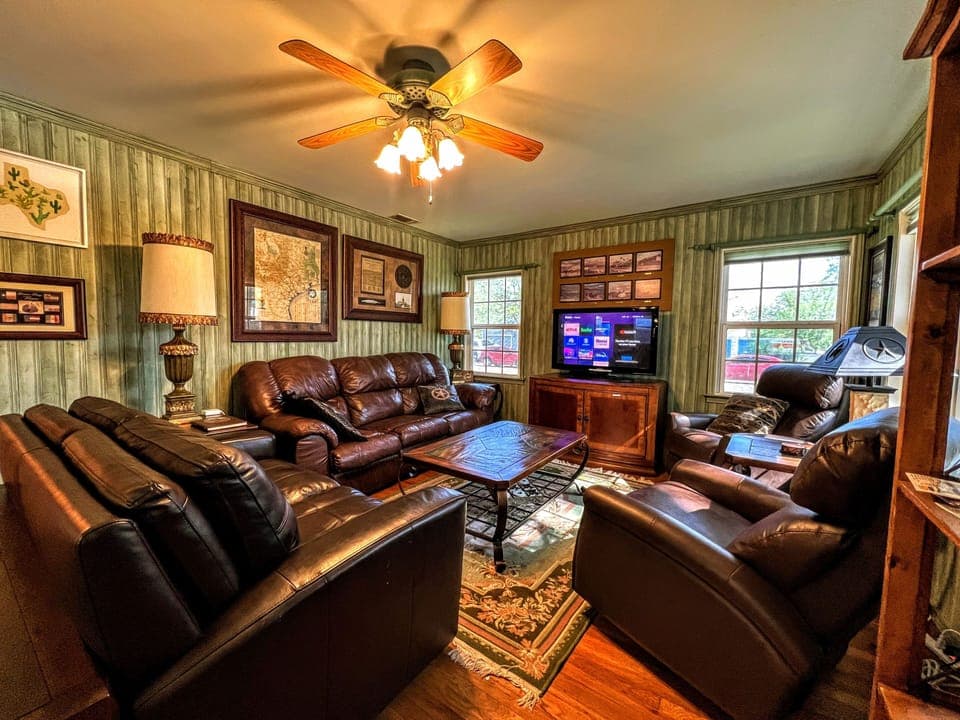 Livingroom area with plenty seating and Texas memorabilia abound  
