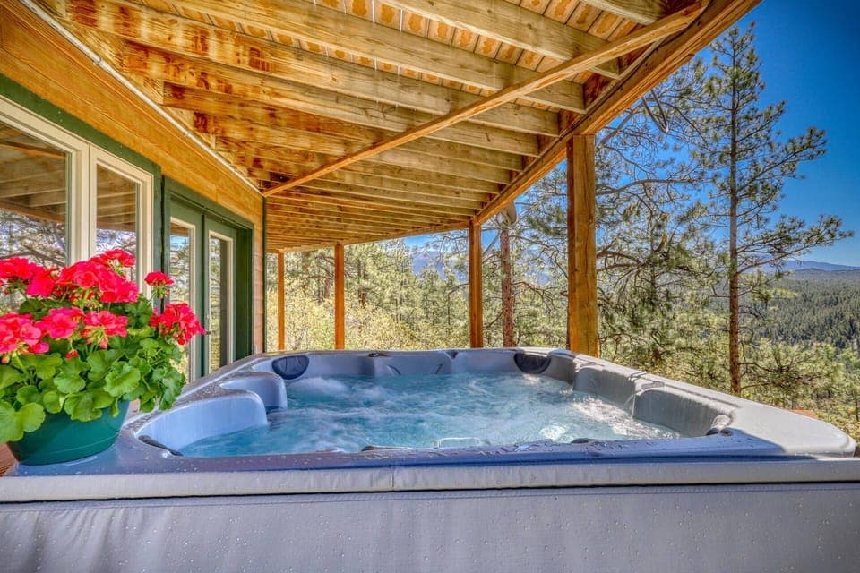 Sky Vista Lodge is a spectacular 5 bedroom 3 bath, 3079 sf home in a stunning forested setting with mountain views. This 5 star home sleeps 12.