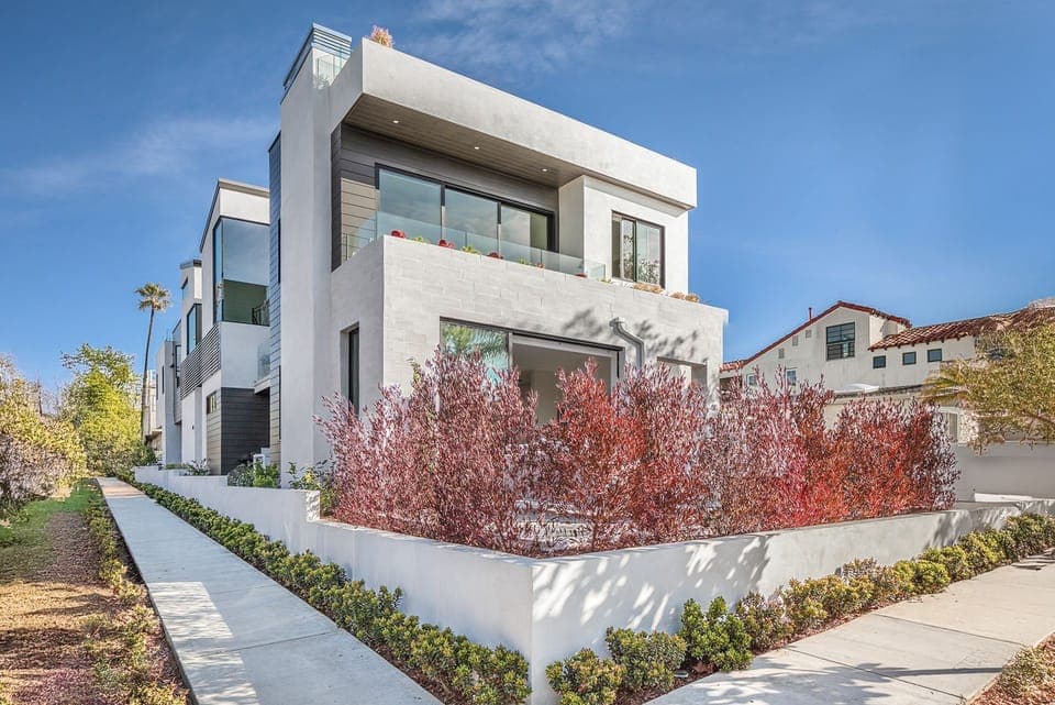 The front of this tri-level home looks out onto the tree-lined streets of Corona Del Mar, for a private and peaceful retreat
                