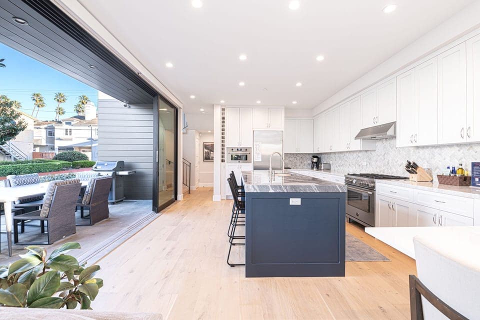 The kitchen is outfitted with premium stainless steel appliances and all the necessary cook and bakeware
                