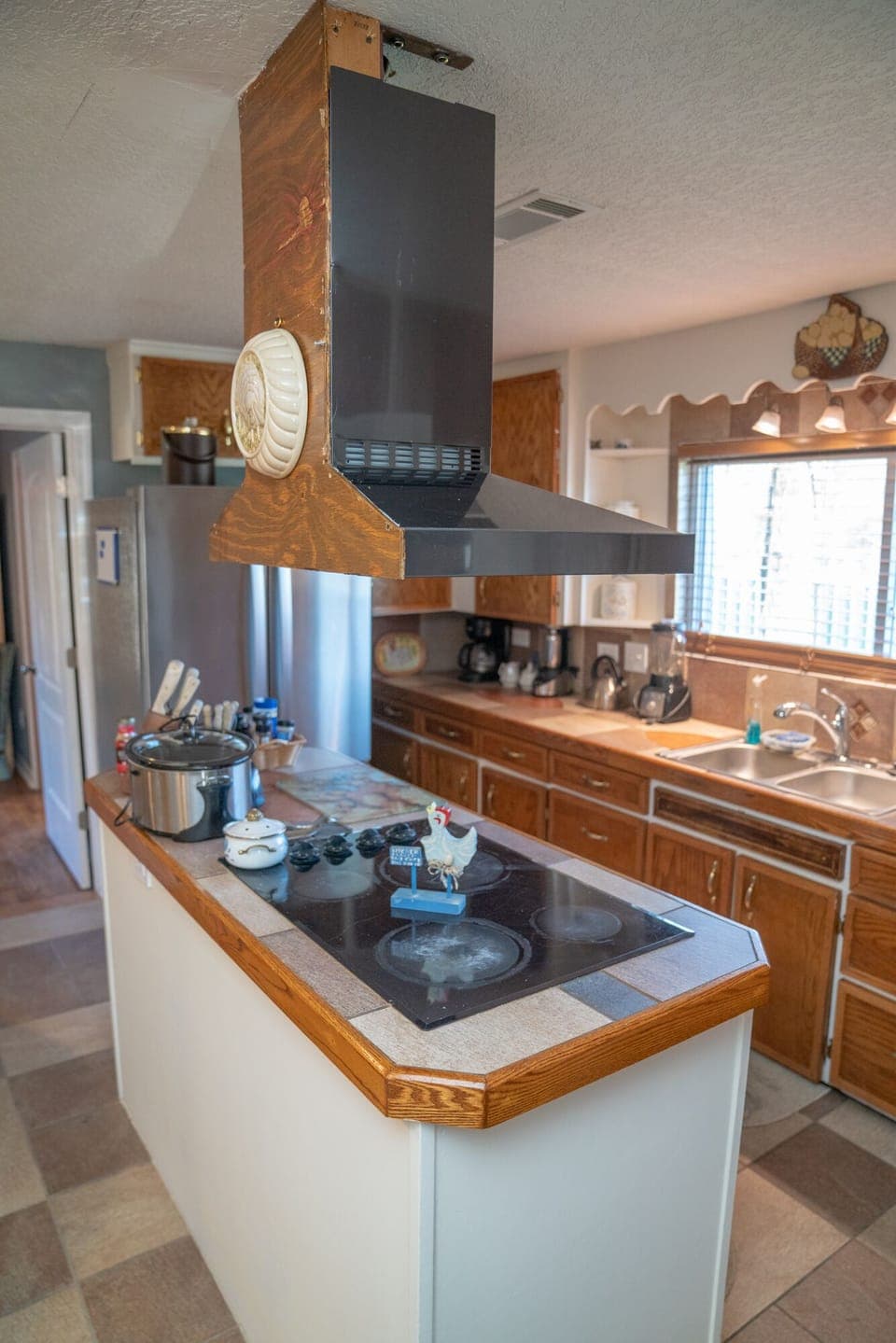 The Heart of the House w/built-in stovetop & oven, 3-door stainless fridge. 
