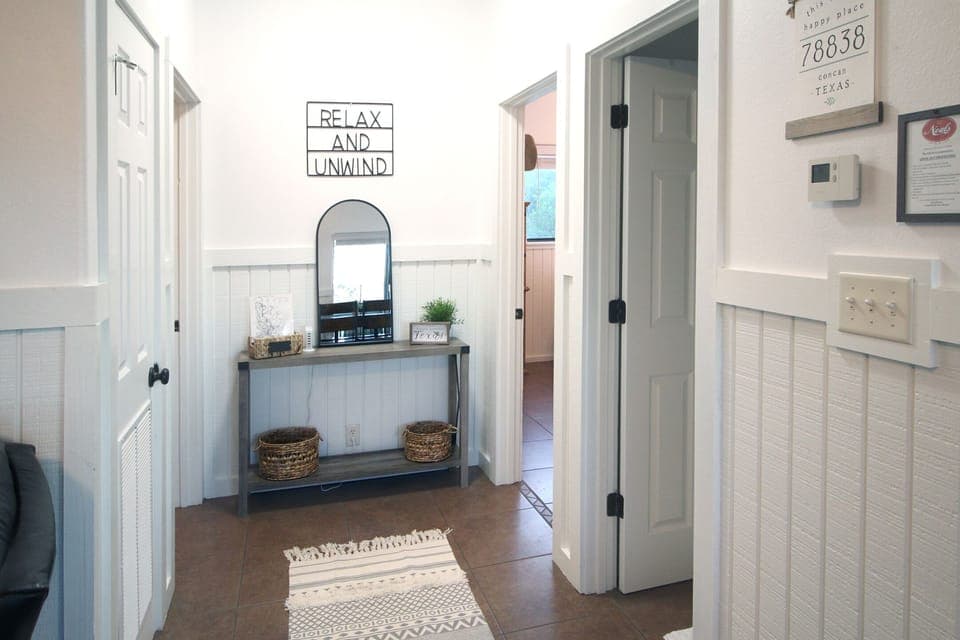 hallway to 1st bathroom and bedrooms