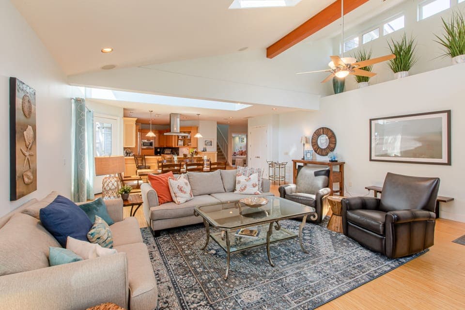 Open design makes it easy to connect throughout the living, dining, and kitchen areas.