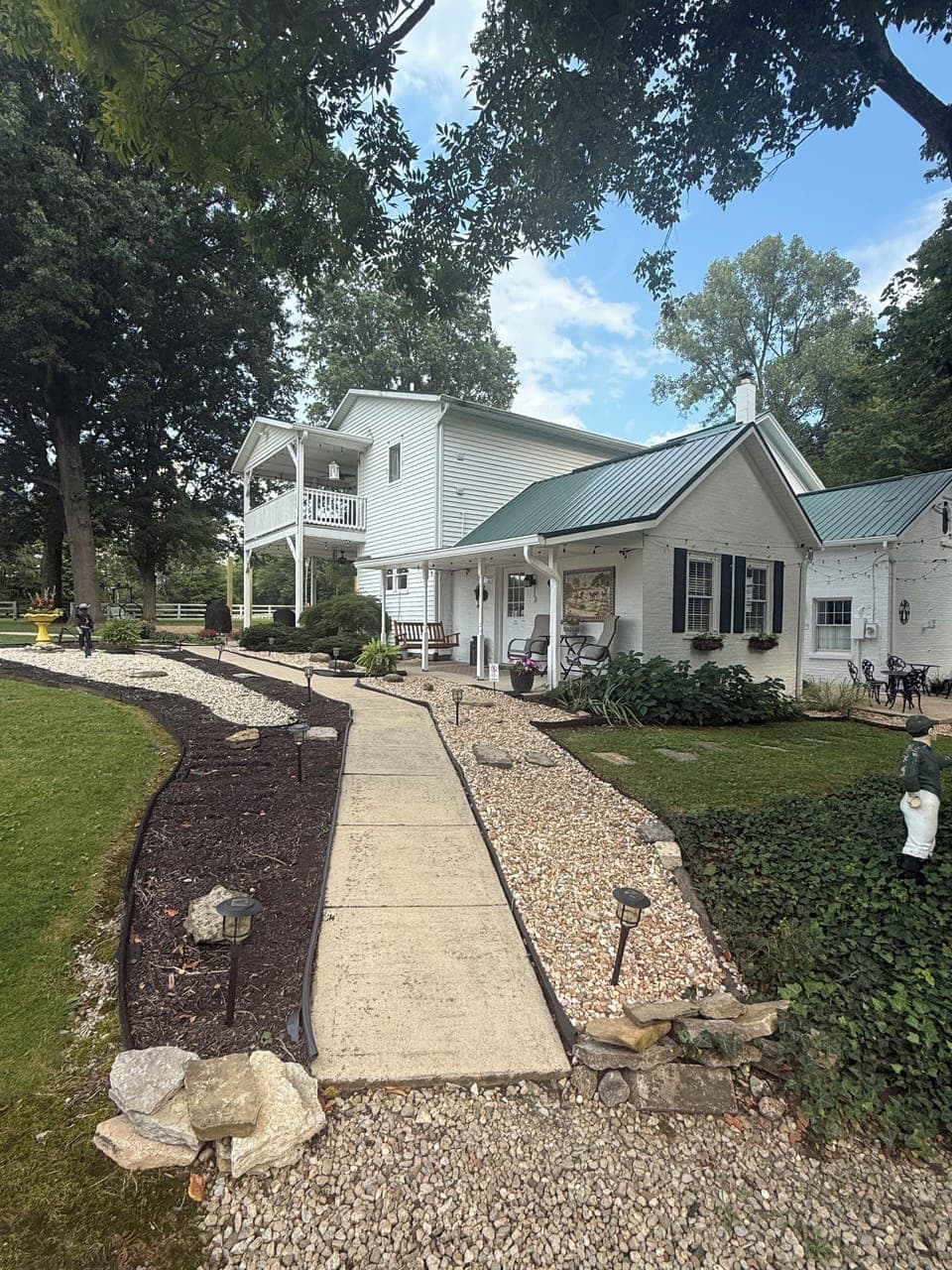 View of your walkway all lit up at night.