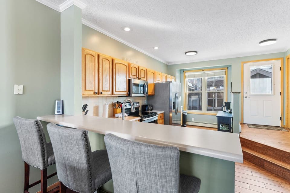 Breakfast bar seating 3 for casual dining and quick meals.