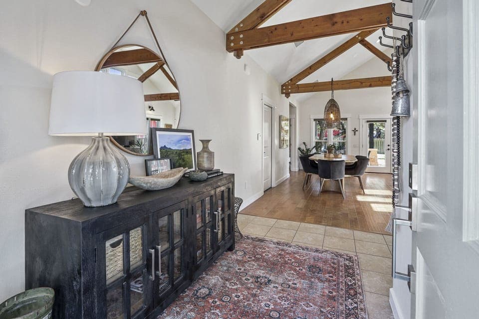 Closer view of side table with dining table in foreground.