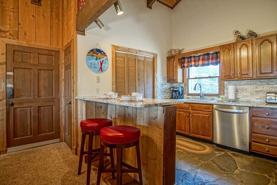 There is room for 2 at the kitchen bar to set.