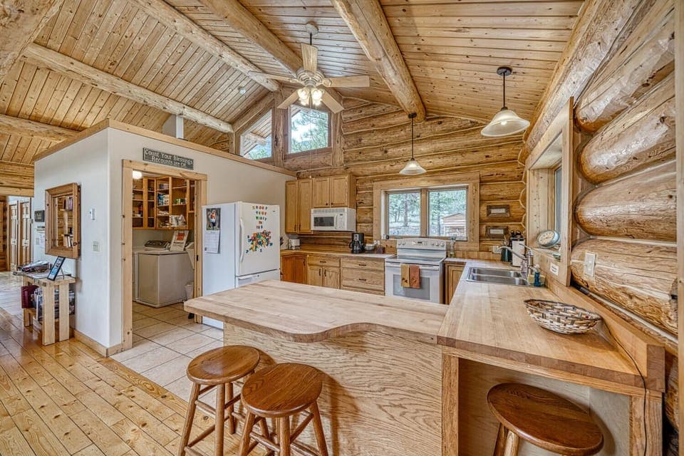 Fully-appointed kitchen with pantry and laundry area.