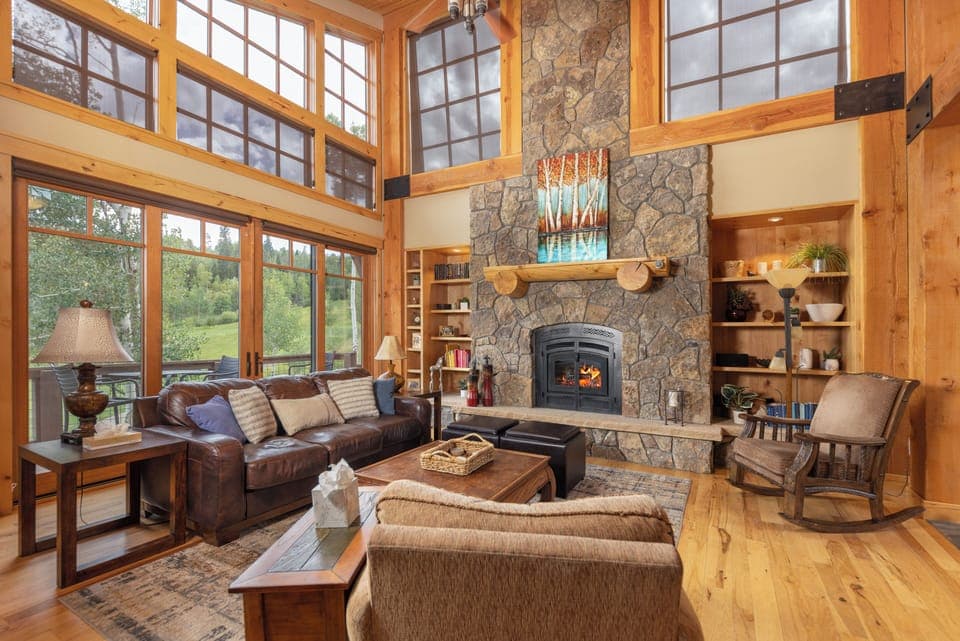 Main level living room with gas fireplace.