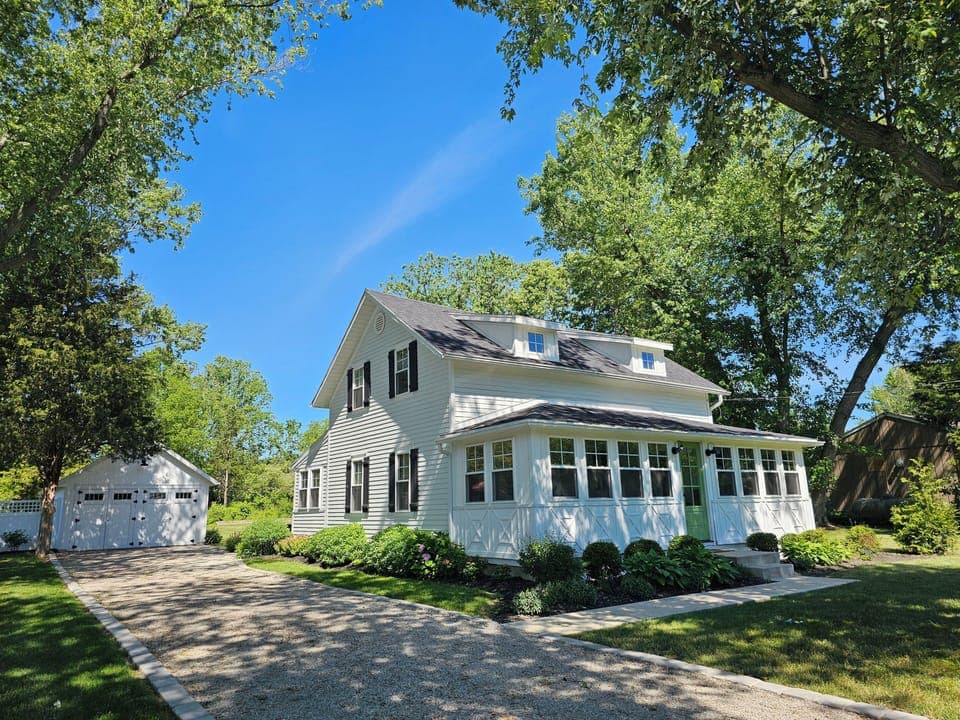 Front of property & garage (front of garage houses w/d, games, bikes)