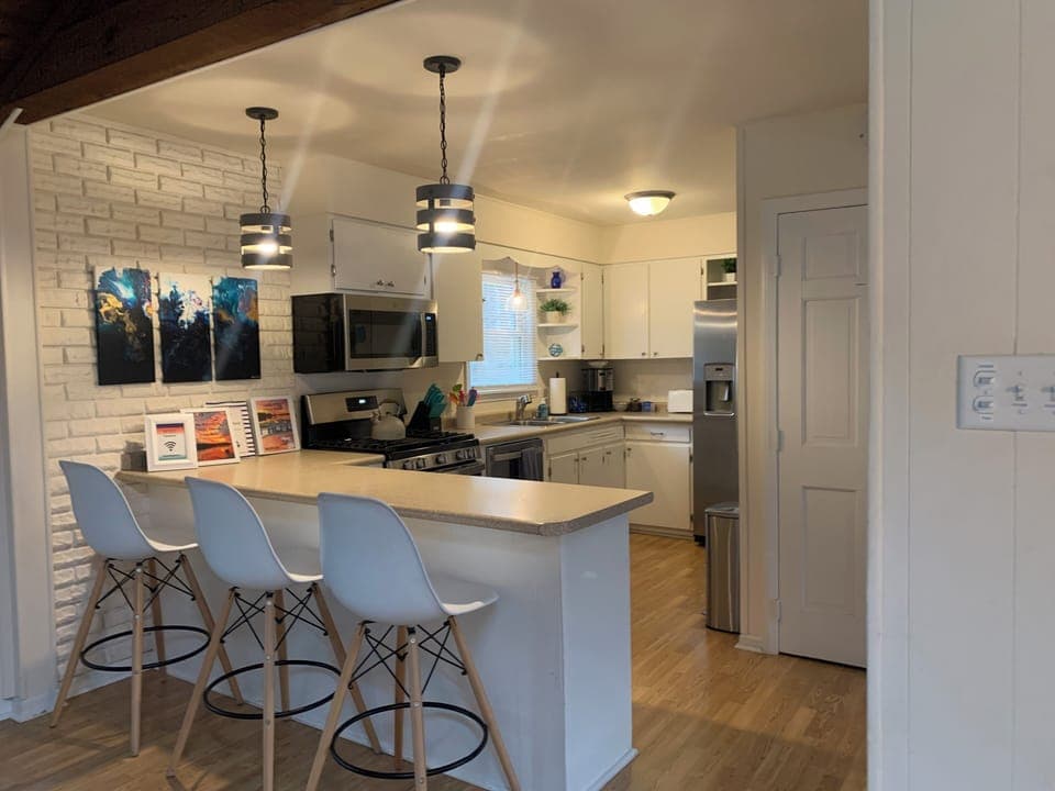 Seating for three at the breakfast bar.