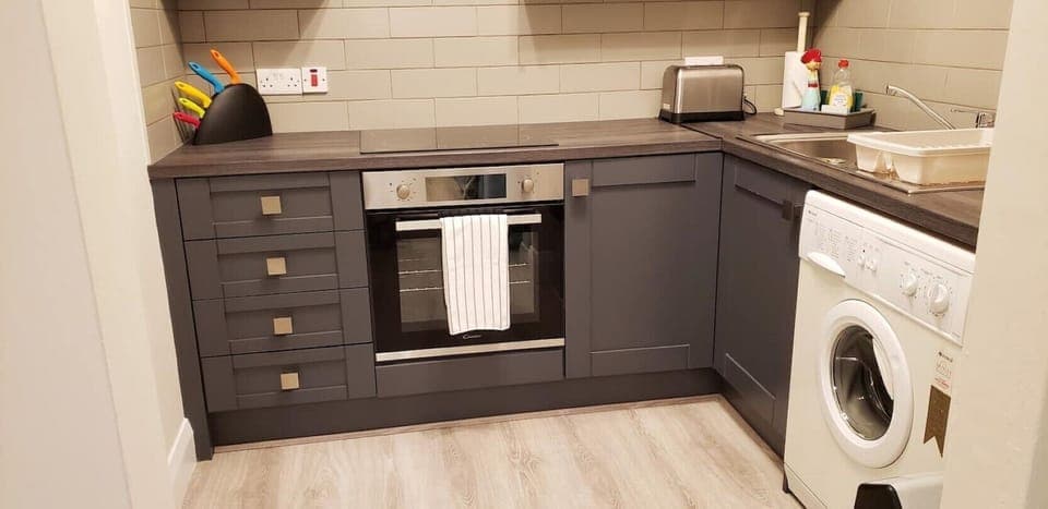 Kitchen showing stove and washer.