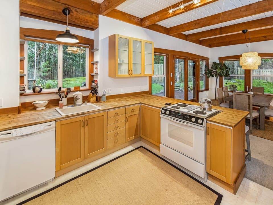 Full kitchen with open concept to dining room and living room