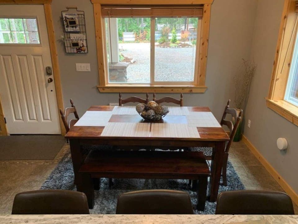 The dining table has 2 extensions and will seat up to 10.