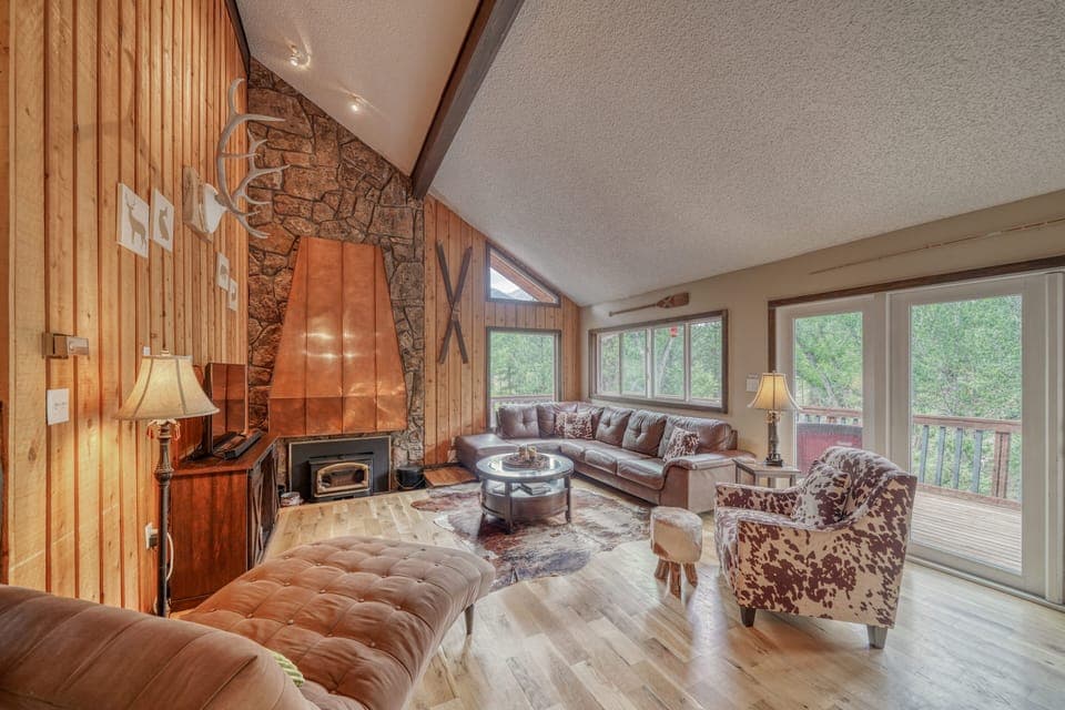 Large open-concept living room with fireplace and TV with streaming capabilities.