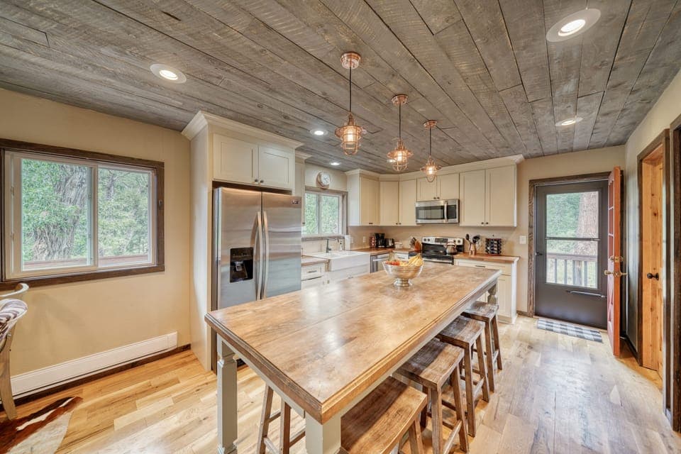 Fully-appointed kitchen with bar seating.