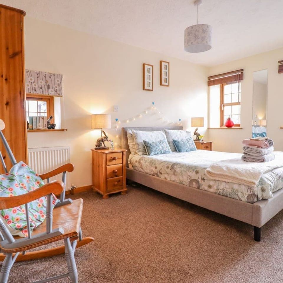 Spacious and super comfy master bedroom with King sized bed, TV and storage.