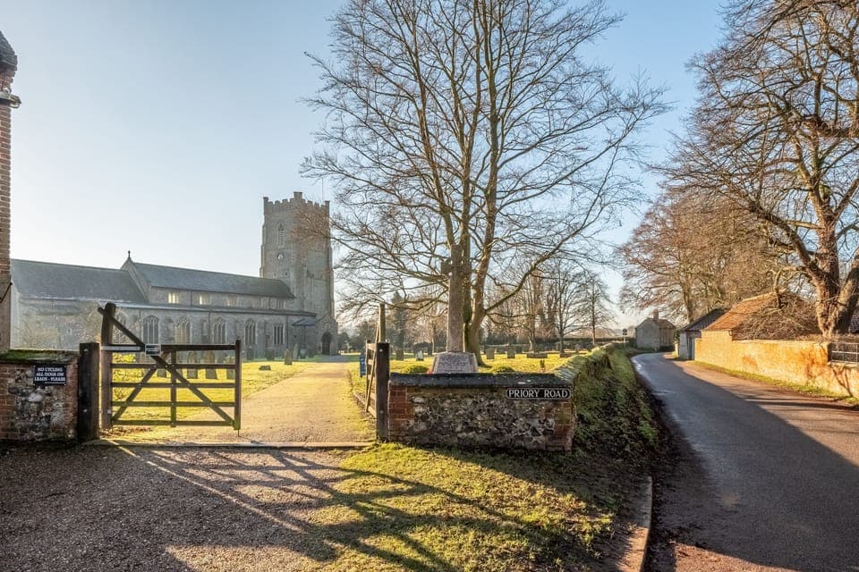 Access to the front entrance of the cottage is via the churchyard