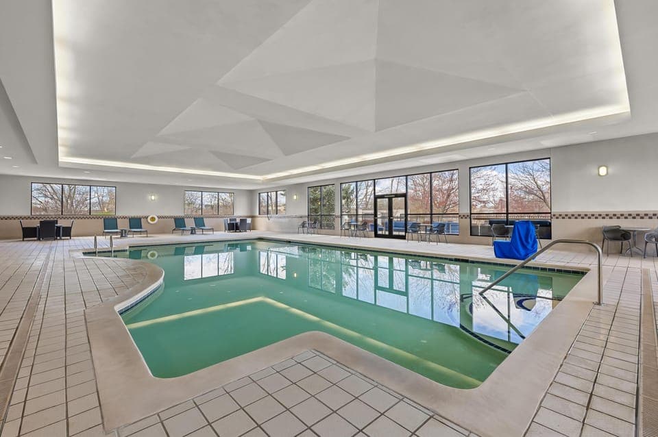 Indoor pool, open 9:00 AM to 10:00 PM, pool umbrellas, sun loungers