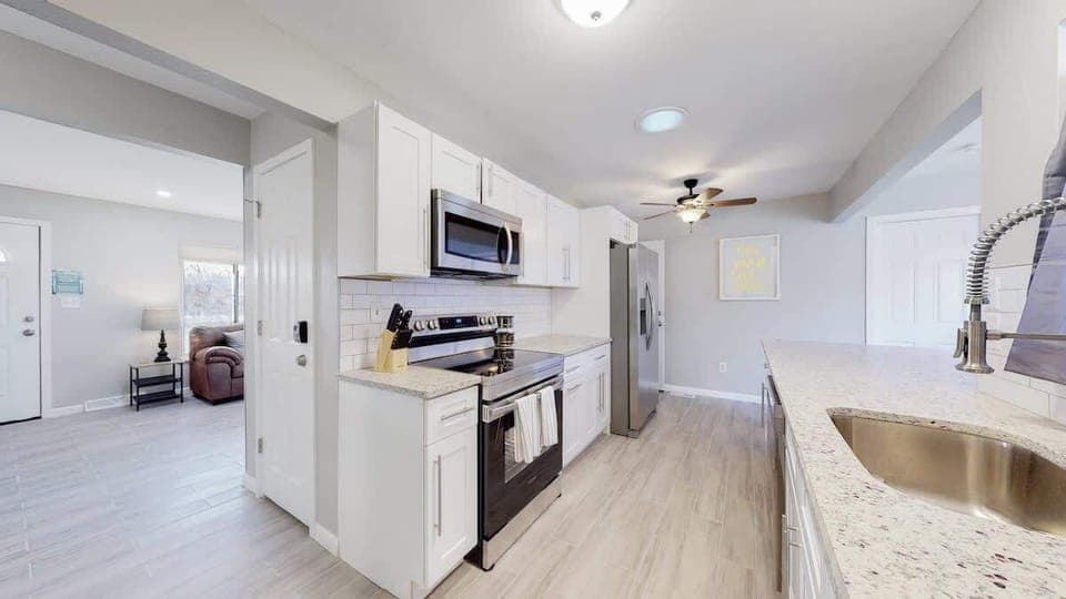 Modern Kitchen fully equipped with appliances, cookware, tableware, cutlery and a stocked Keurig