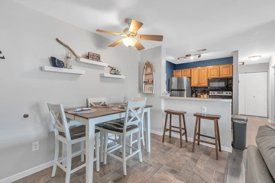 Key to pool area and pool bracelets stored in row boat on dining room wall .