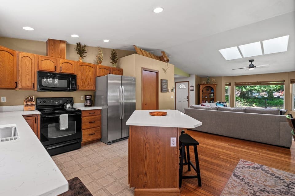 Open-concept living  with kitchen flowing seamlessly into the family room.